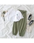 Dwuczęściowy zestaw damski młodzieżowy krótki crop top długie spodnie modny elegancki nowoczesny