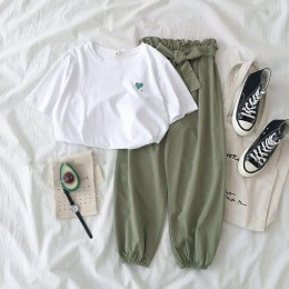 Dwuczęściowy zestaw damski młodzieżowy krótki crop top długie spodnie modny elegancki nowoczesny