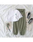 Dwuczęściowy zestaw damski młodzieżowy krótki crop top długie spodnie modny elegancki nowoczesny