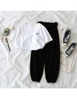 Dwuczęściowy zestaw damski młodzieżowy krótki crop top długie spodnie modny elegancki nowoczesny