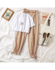 Dwuczęściowy zestaw damski młodzieżowy krótki crop top długie spodnie modny elegancki nowoczesny