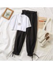 Dwuczęściowy zestaw damski młodzieżowy krótki crop top długie spodnie modny elegancki nowoczesny